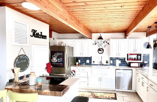 Center Ridge Casa | Watershed Getaway on lake, mountain behind house on property, and hiking trails