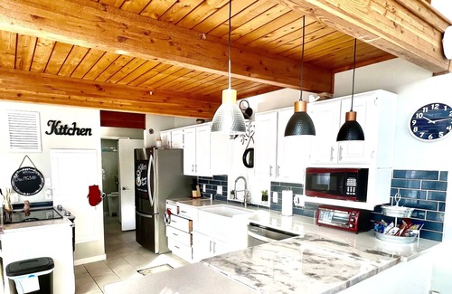 Center Ridge Casa | Watershed Getaway on lake, mountain behind house on property, and hiking trails