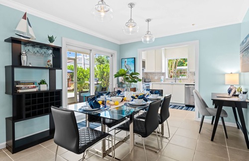 Poinsettia Heights Casa | Welcome to Pelican Landing, A Cozy Tropical Heated Pool Home!