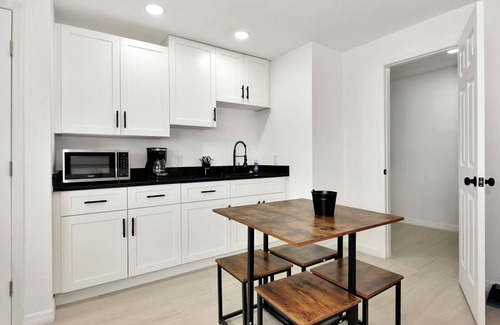 Daytona Beach Shores Hotel | Daytona FL Studio suite King bed kitchen walk in shower #11