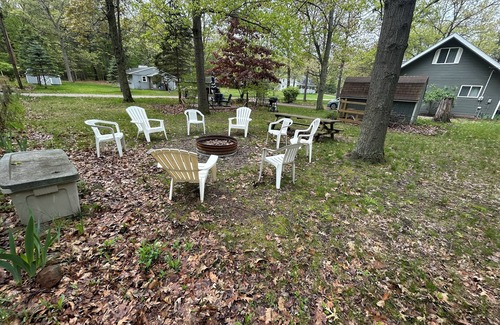 Caseville Cabaña | ‘Whispering Oaks’ Cottage with Private Lake Access, Outdoor Fire Pit and More!