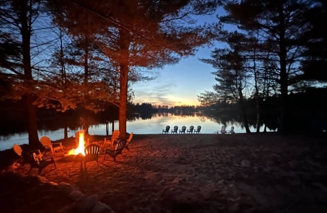 1/2 acre, 450 feet of lake frontage and a sandy beach with sunsets!
