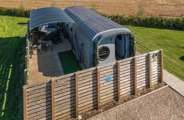 Uniquely designed, luxury, glamping Anthropod stay with private hot tub set in scenic countryside.
