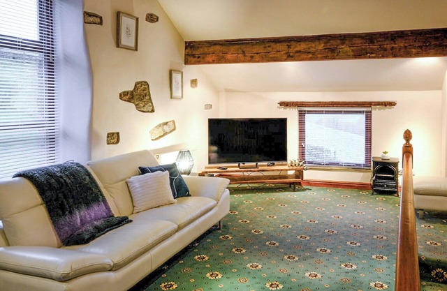A rural cottage with stunning views over the countryside offering peaceful accommodation.