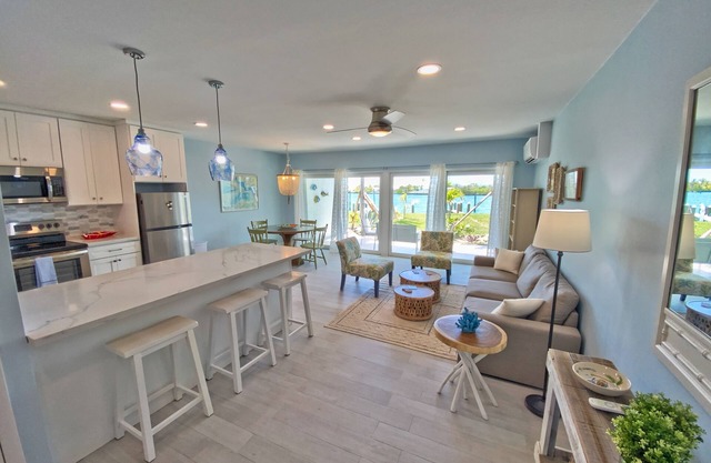 100% Renovated Ground floor condo w/Boat Slip - 3 min walk to beach!!