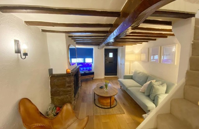 1750's cottage with open fire and beams