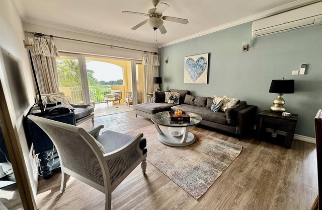 2 /Bed Condo, w/AC, Pools, Rooftop patio, 5 Min to Beach, in a gated community.