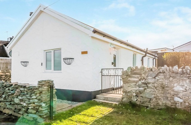 Nestled in the picturesque Four Mile Bridge, offering stunning views of the surrounding coastline.