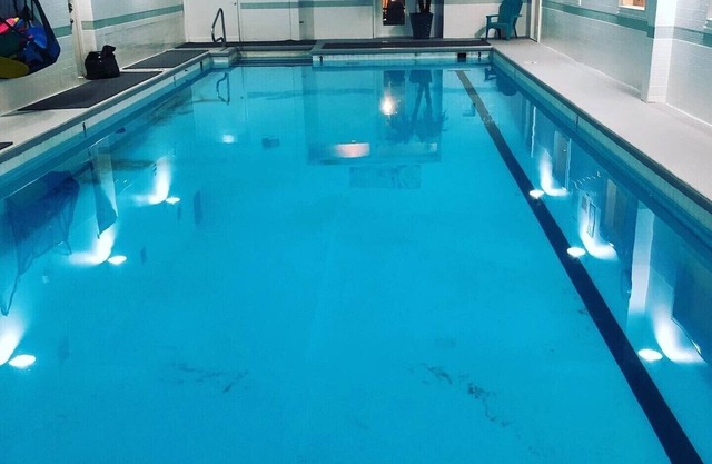 2 Bedroom Downtown Condo above Gym with Pool Hot tubs sauna etc.
