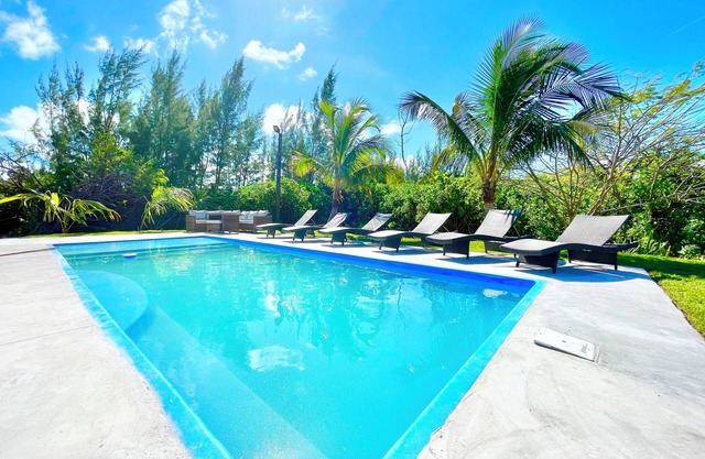 2 master suites w/ 2 separate living spaces w/ pool & private beach access