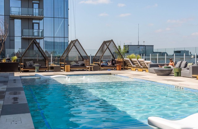 20th floor condo with pool on Rainey St by Locale