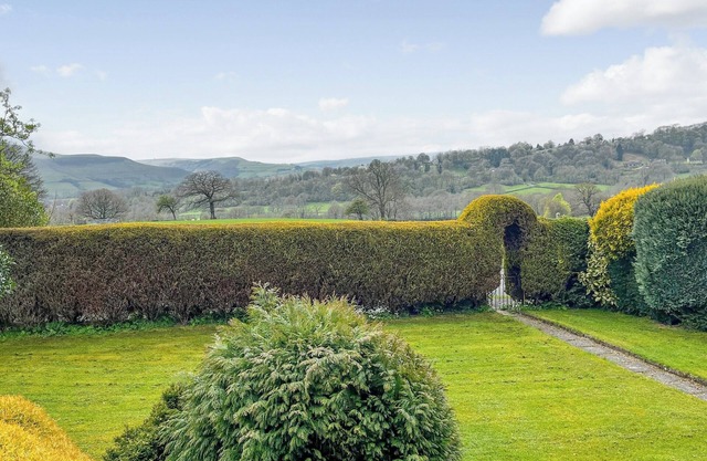 A traditional bungalow with stunning views over the Peak District landscape.