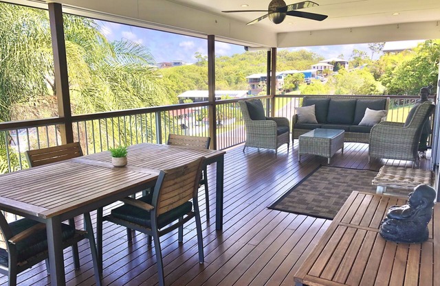 4 bedroom home with 180 degree ocean and township views. Walk to beach and shops
