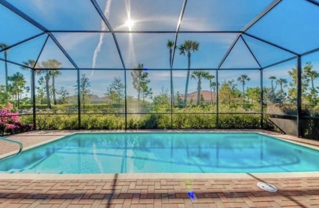 4 bedrooms 3.5 bathrooms heated swimming pool screen caged & fenced around home
