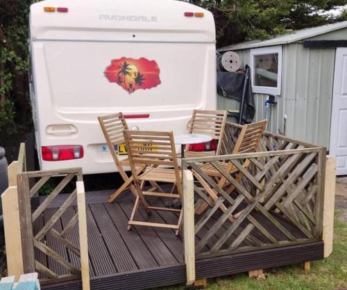 4 berth caravan in a garden, nestled in the trees