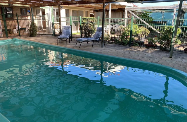4 or 5 bedroom home with solar heated, undercover outdoor pool. Pet friendly.