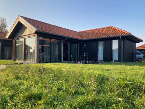 4-person chalet Albatros by the water with parking space