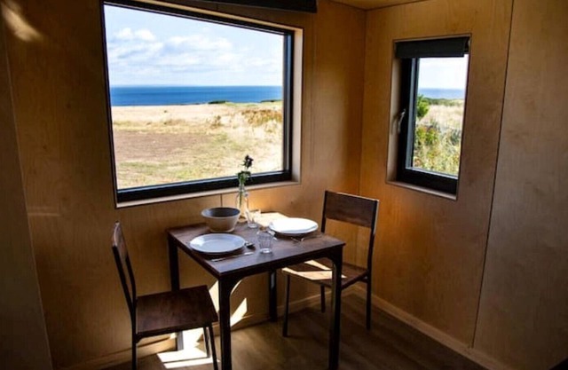 5 rustic cabins, sea views from rewilded farm