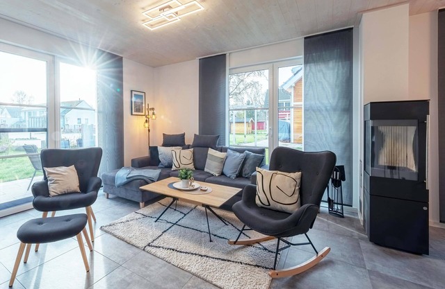 5-star vacation home Ostseetraum on the water with fireplace, terrace and Bodden view