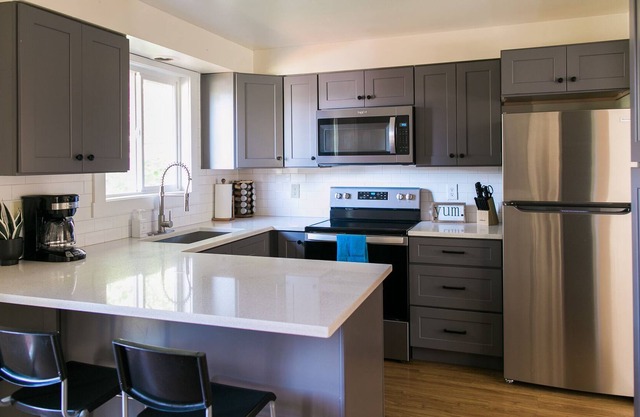 9 beds! Sleeps 16! 6 bedrooms, 4 bathrooms, 2 kitchens… rent a whole duplex!