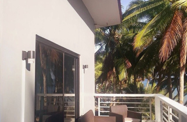 A 3 floor contemporary styled beach house. Steps away from fine white sands!
