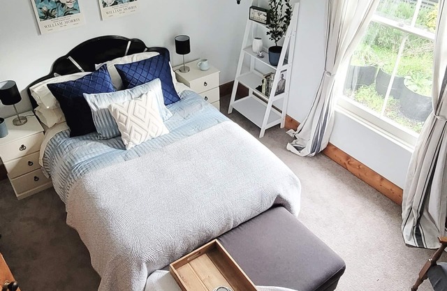 A charming 4-bedroom home! Just steps away from cozy cafes and local shops.