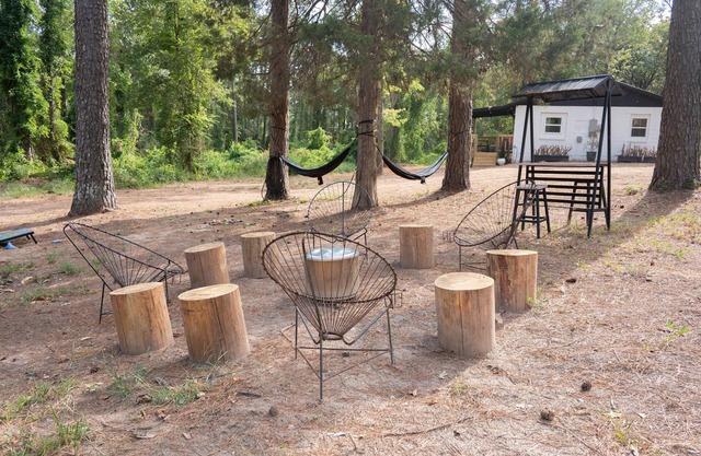 A charming quirky retreat nestled amidst the beauty of many majestic trees.