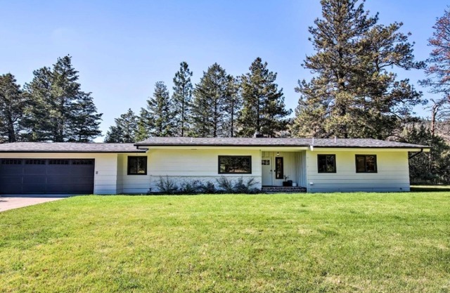 A charming riverfront 3-bedroom house bordering the Clark Fork River.