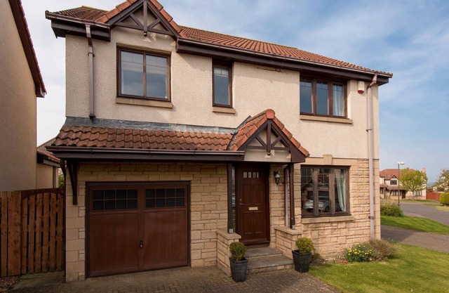 A fabulous 4 bedroom detached house, with attractive garden and private parking.