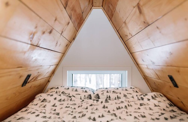 A Frame Cabin at the top of a ski hill