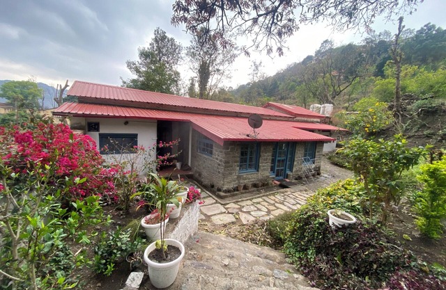 A heritage British bungalow beautifully restored as a homestay near Nainital.