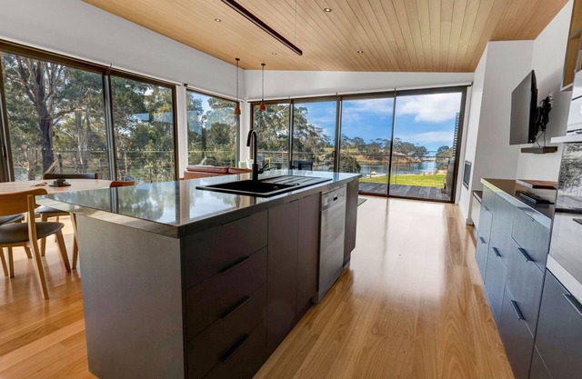 A modern and exquisitely decorated studio perched atop the serene shoreline