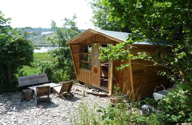 A romantic riverside cabin for an intimate and peaceful getaway.