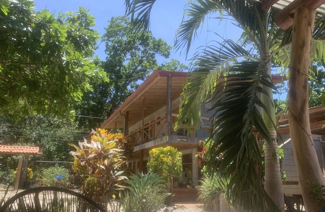 A rustic lodge surrounded by gardens, in a jungle setting - double Room 1