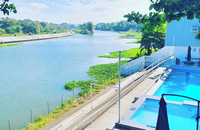 A slice of paradise with a beautiful river view and infinity pool.