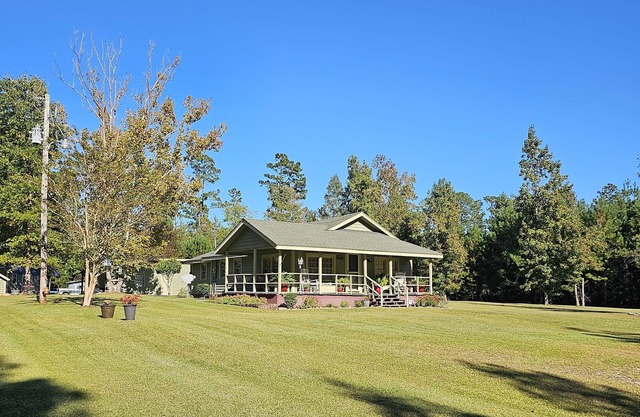 Evergreen Cottage sits secluded on 2.33 ac. near Hwy. 90, 22 & International Dr
