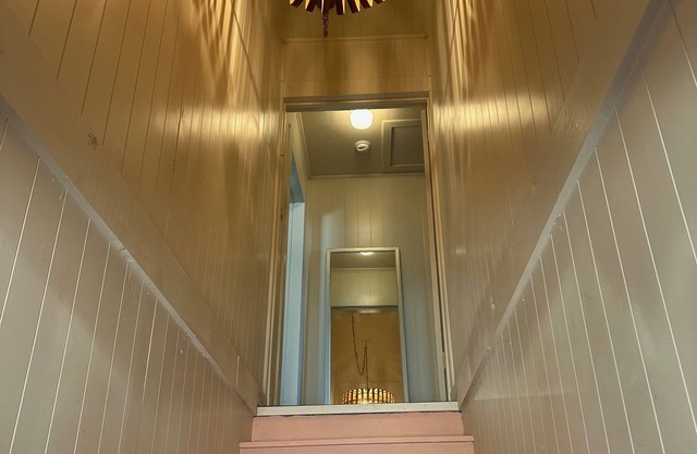 Above the pink stairs ~ a quiet eclectic garage apartment.