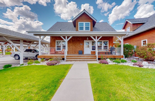 Adorable, two-story home with a furnished front porch, fireplace, & washer/dryer