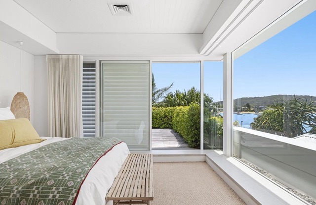 Agave Waterfront at Wagstaffe - From the moment you arrive through private gates and down the white granite driveway of Agave, you'll be captivated by the attention to detail in design, beautiful Hampton-inspired interiors, and lavish finishing of this...