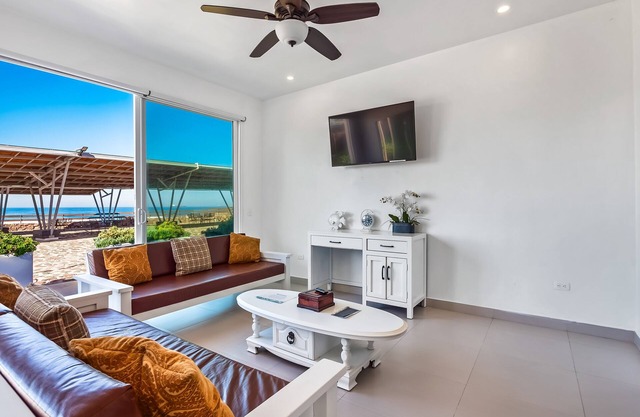 Airy, beach-view dog-friendly villa with patio, outdoor pool, streaming, AC