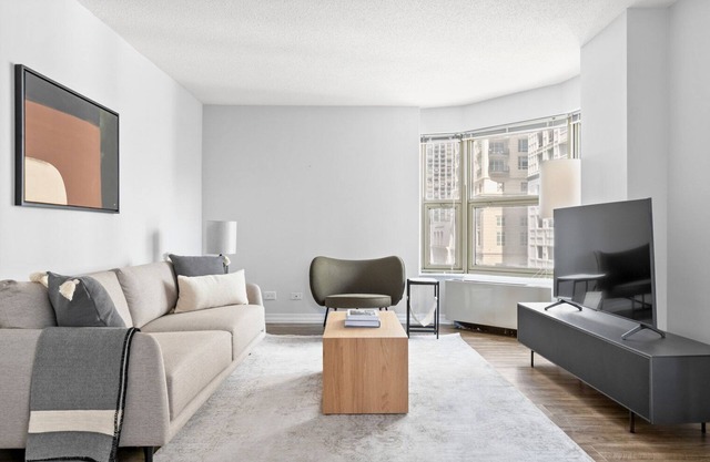 Amazing Gold Coast 1BR w/ Deck, Gym & Lounge, 1 block to L, by Blueground