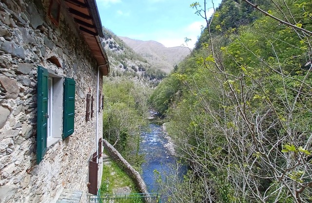ANCIENT HOUSE ON THE RIVER