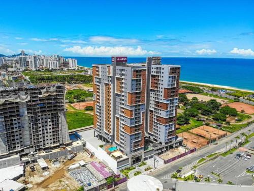 Ap novo em frente a shopping center e próximo a praia