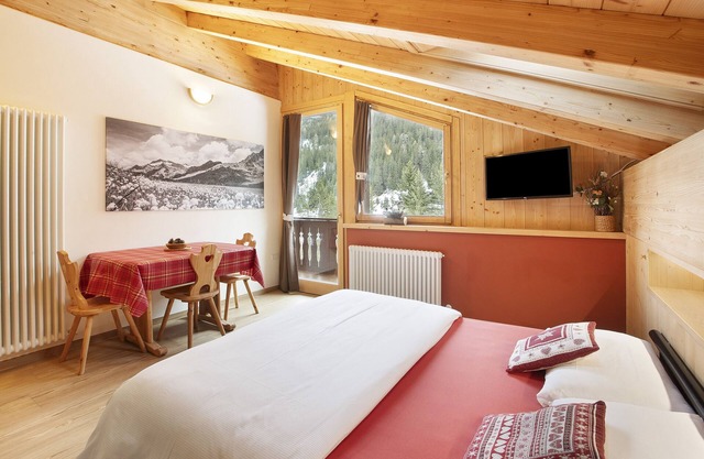 Apartamento 'Chalet Primula 14' con vistas a la montaña, jardín compartido y Wi-Fi