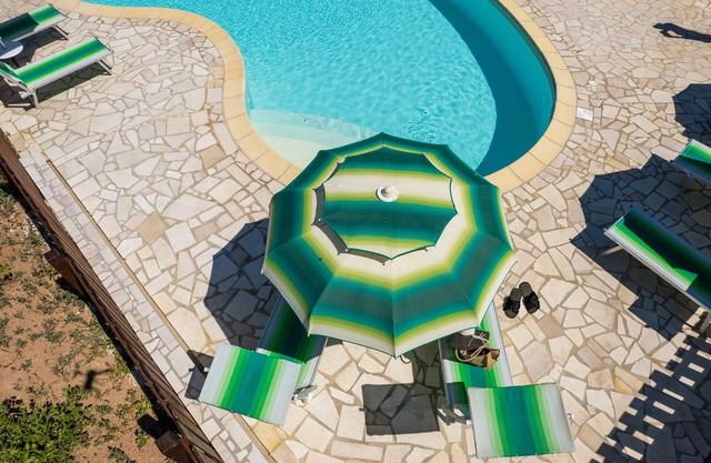 Apartamento 'Casa Lentischio Piscina Evista Mare' con vistas al mar, piscina compartida y Wi-Fi