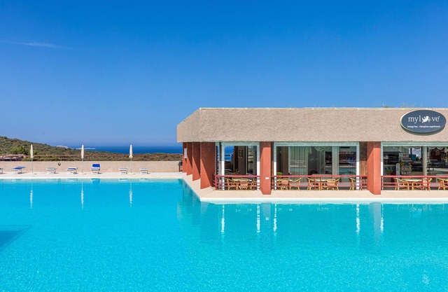 Holiday Apartment "Casa Vacanze Cugnana Verde" with Sea View, Balcony, Terrace, Shared Garden & Pool; Parking Available