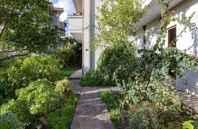 Apartamento 'Casa vacanza Sandra' con jardín, terraza y aire acondicionado