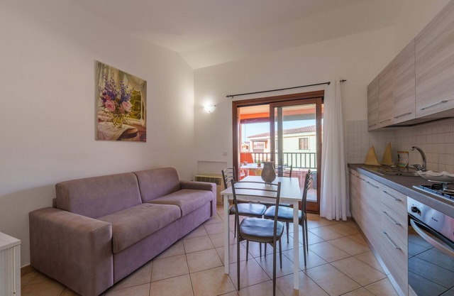Apartamento 'Casa Vacanze Susino' con piscina compartida, terraza privada y aire acondicionado