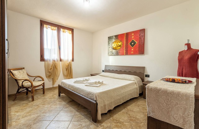 Apartamento 'Casa Vacanze Vicino ad Alghero' con terraza, jardín y Wi-Fi