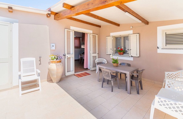 Apartamento 'Nonna Rosa' con terraza privada, jardín compartido y aire acondicionado